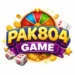 Pak804 Game logo with colorful spin wheel, gold coins, dice, and playing cards, featuring bold yellow “PAK804” text and a purple “Game” banner on a bright gaming-themed background.